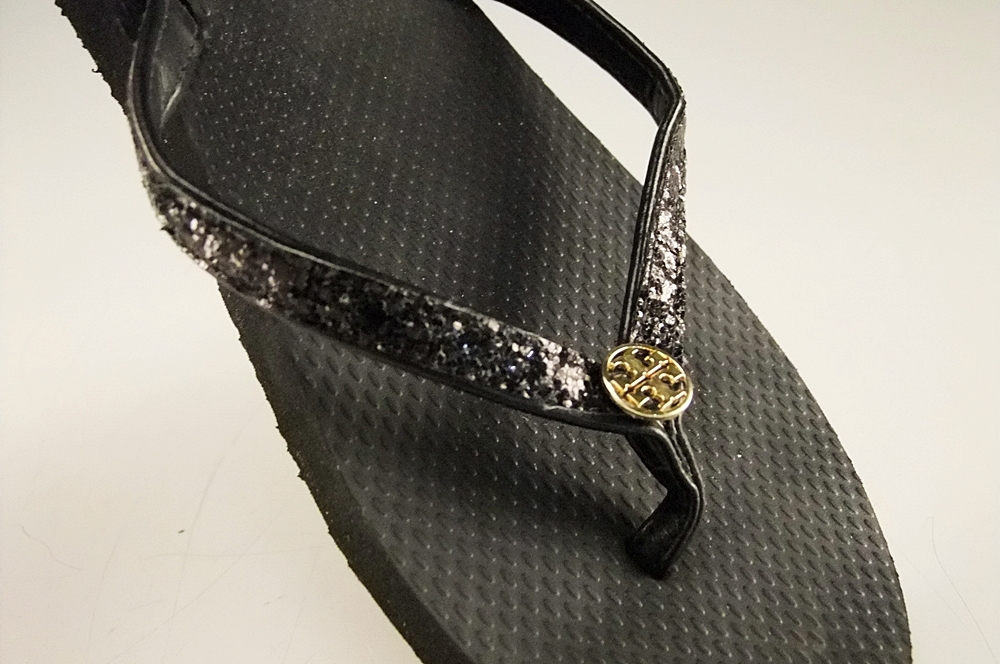 Pair of Tory Burch Black Adia Glitter Flip Flops with Goldtone Log