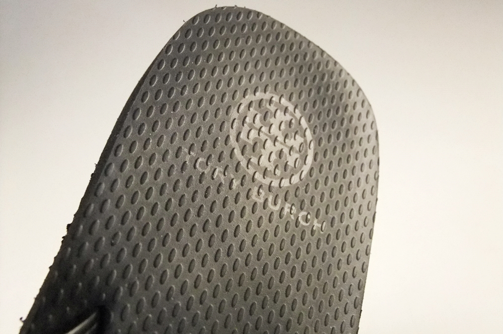 Pair of Tory Burch Black Adia Glitter Flip Flops with Goldtone Log