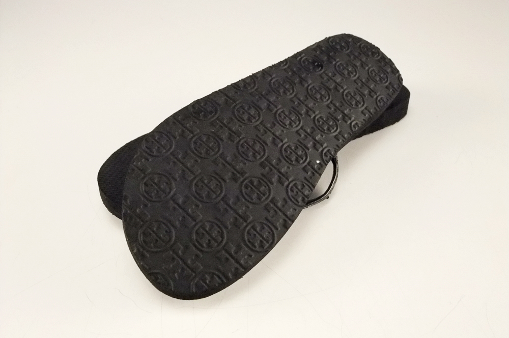 Pair of Tory Burch Black Adia Glitter Flip Flops with Goldtone Log