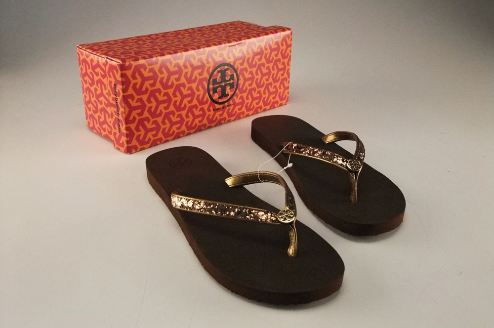 Pair of Tory Burch Bronze Adia Glitter Flip Flops