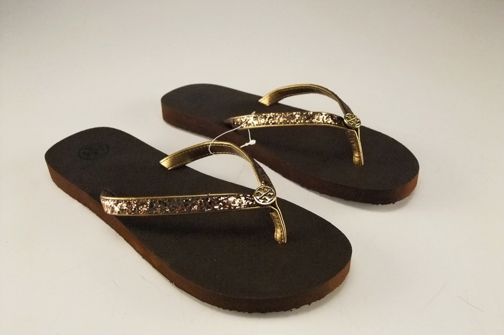 Pair of Tory Burch Bronze Adia Glitter Flip Flops