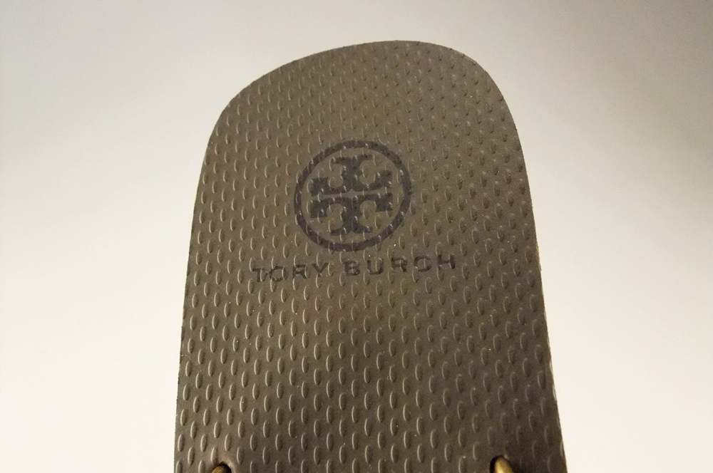 Pair of Tory Burch Bronze Adia Glitter Flip Flops