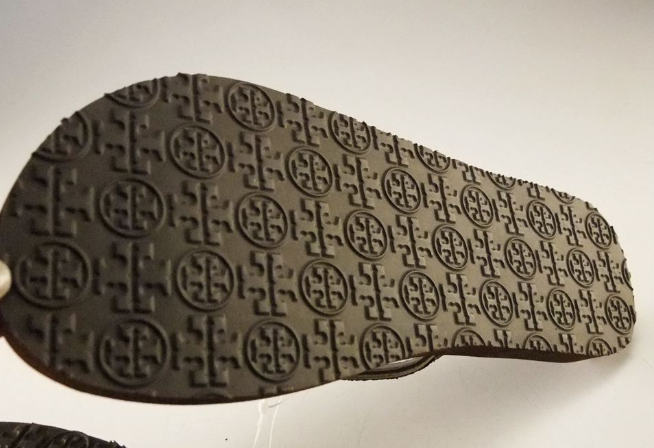 Pair of Tory Burch Bronze Adia Glitter Flip Flops