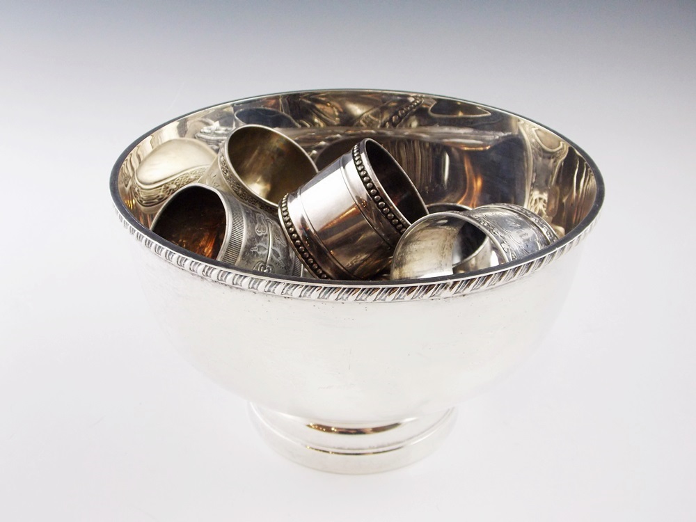 An Elegant Silverplate Bowl with Nine Various Vintage Silverplate Napkin Rings