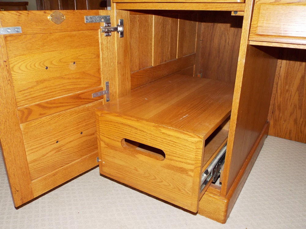 A Solid Oak Roll Top Computer Desk by "Winners Only Inc."