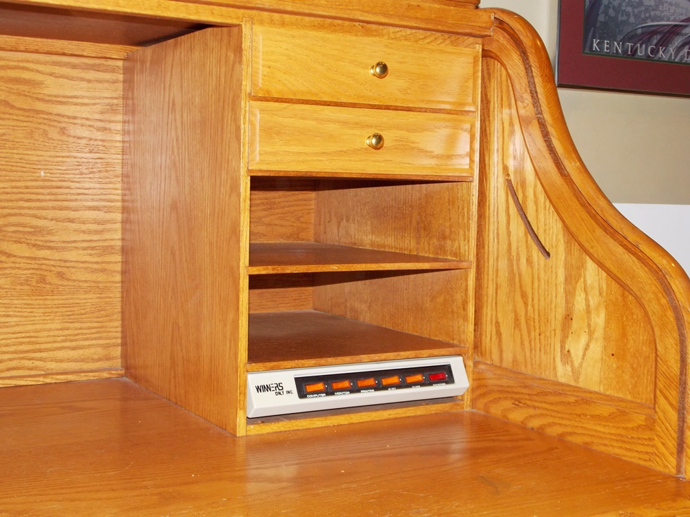 A Solid Oak Roll Top Computer Desk by "Winners Only Inc."