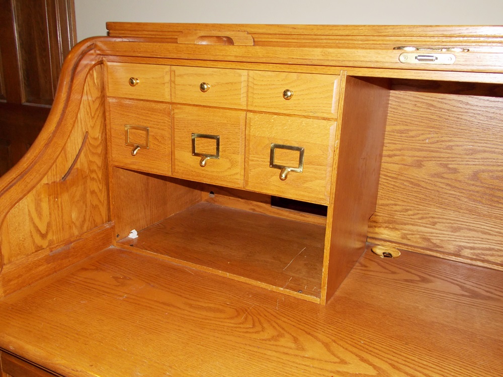 A Solid Oak Roll Top Computer Desk by "Winners Only Inc."