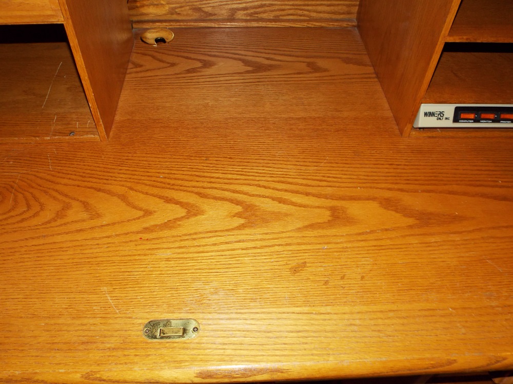 A Solid Oak Roll Top Computer Desk by "Winners Only Inc."