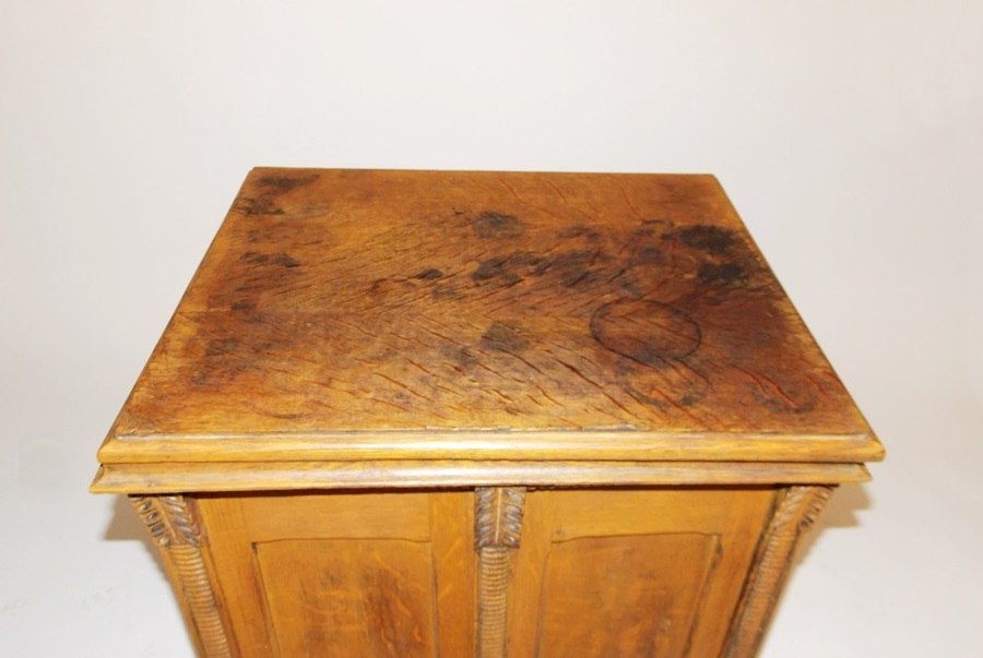An Antique Minnesota Model B Treadle Sewing Machine in a Tiger oak Cabinet