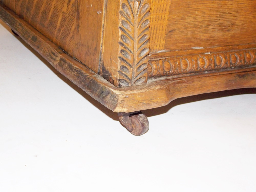 An Antique Minnesota Model B Treadle Sewing Machine in a Tiger oak Cabinet