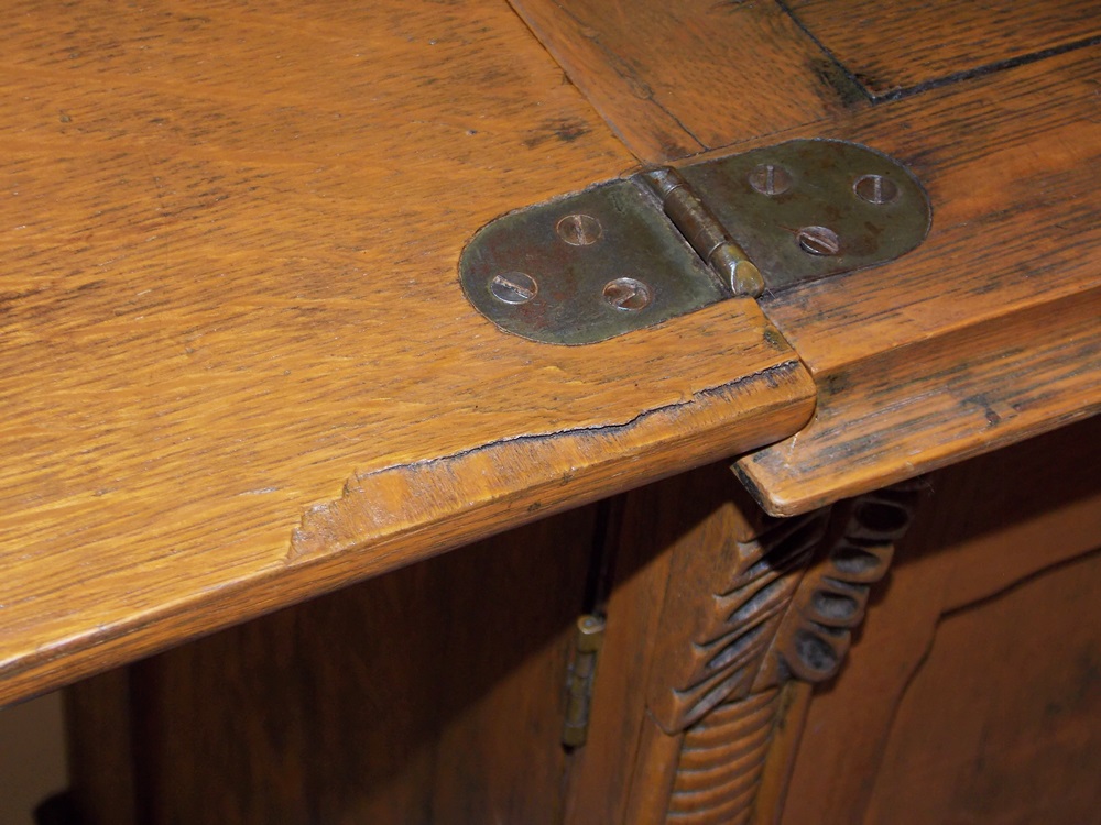 An Antique Minnesota Model B Treadle Sewing Machine in a Tiger oak Cabinet