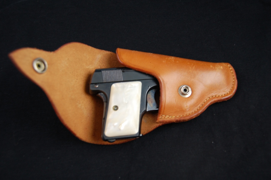 Colt .25 Caliber Pistol with a Mother of Pearl Handle and Holster