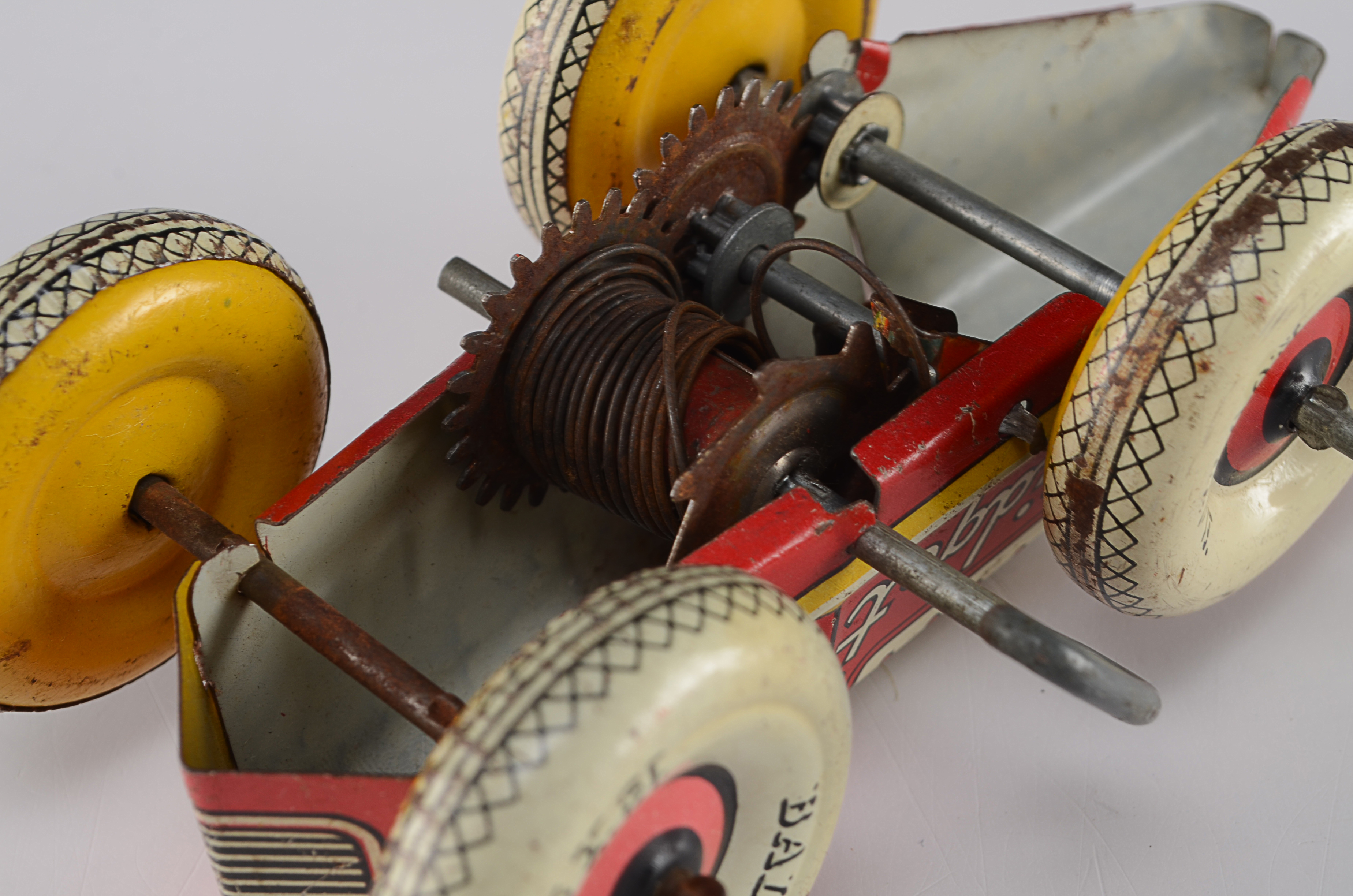 Two Vintage Tin Lithograph Toys, Marx Race Car and Kirchhoff Noise Maker