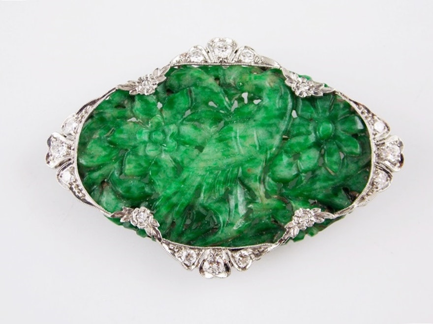 An Exquisite Art Deco Carved Jadeite Pin in a Platinum and Diamond Setting