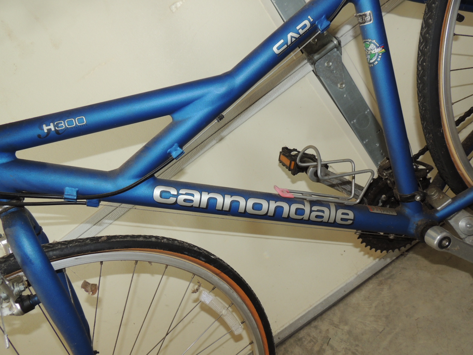 Two Cannondale Bicycles, a Schwinn Bicycle and Two Bike Racks