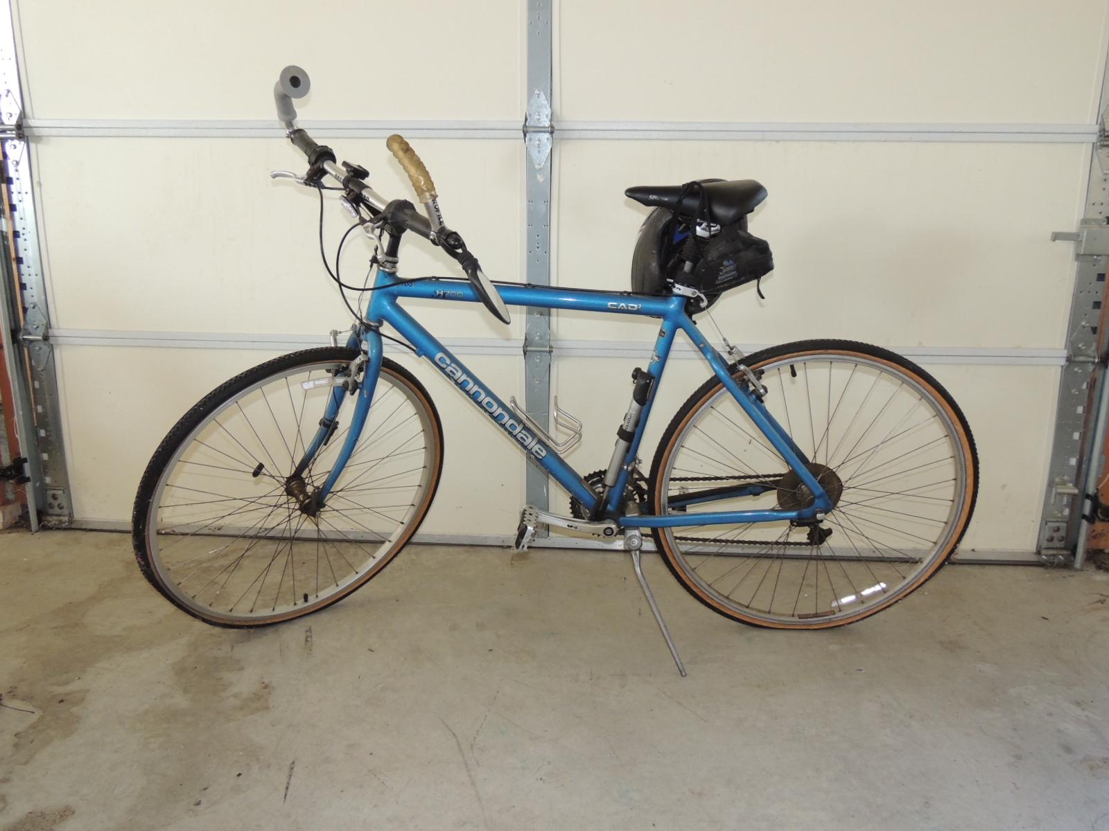 Two Cannondale Bicycles, a Schwinn Bicycle and Two Bike Racks