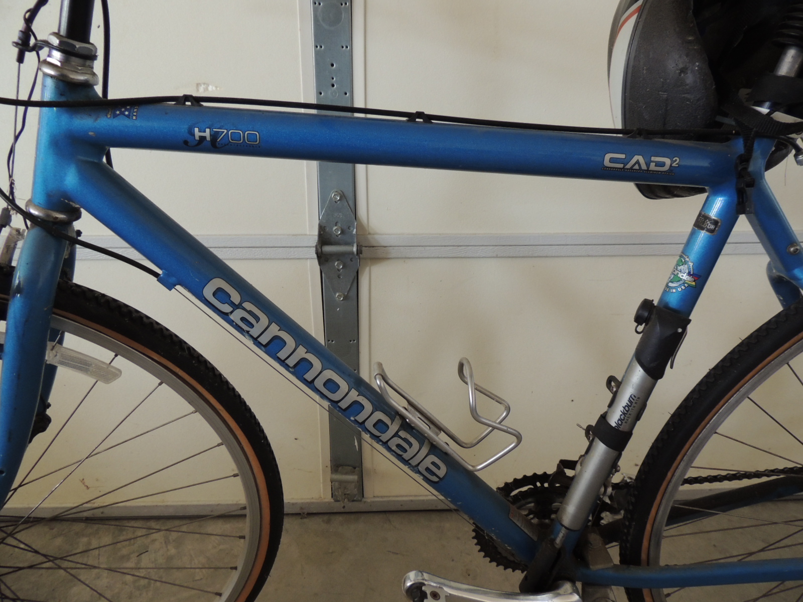 Two Cannondale Bicycles, a Schwinn Bicycle and Two Bike Racks