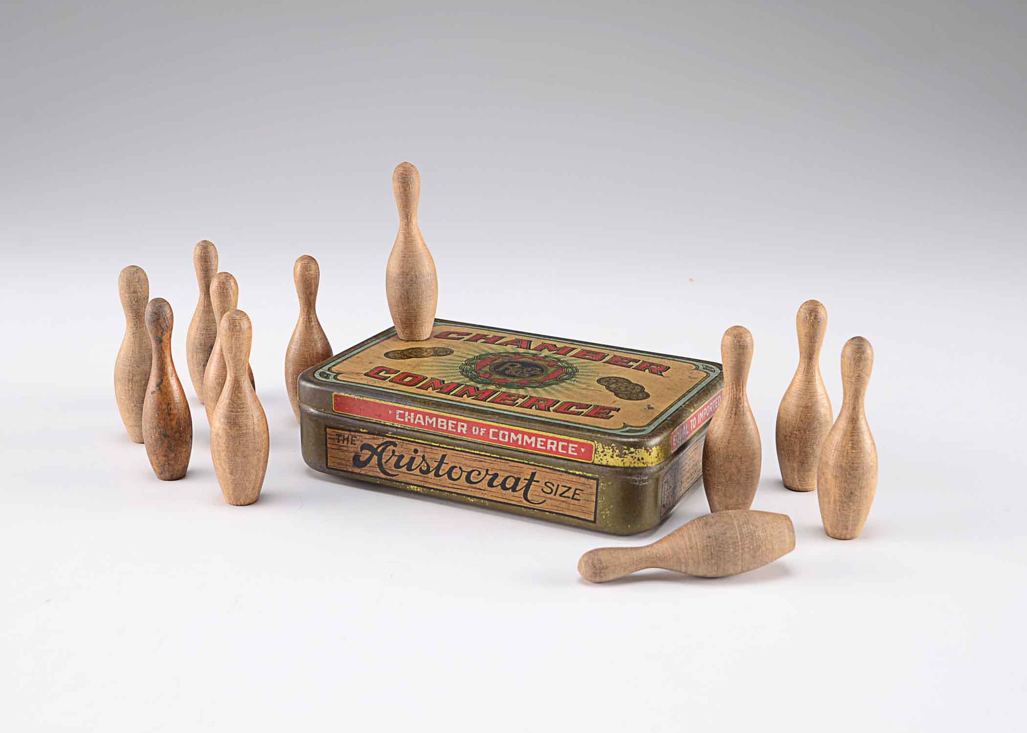 Small Vintage Wooden Bowling Pins in Tin