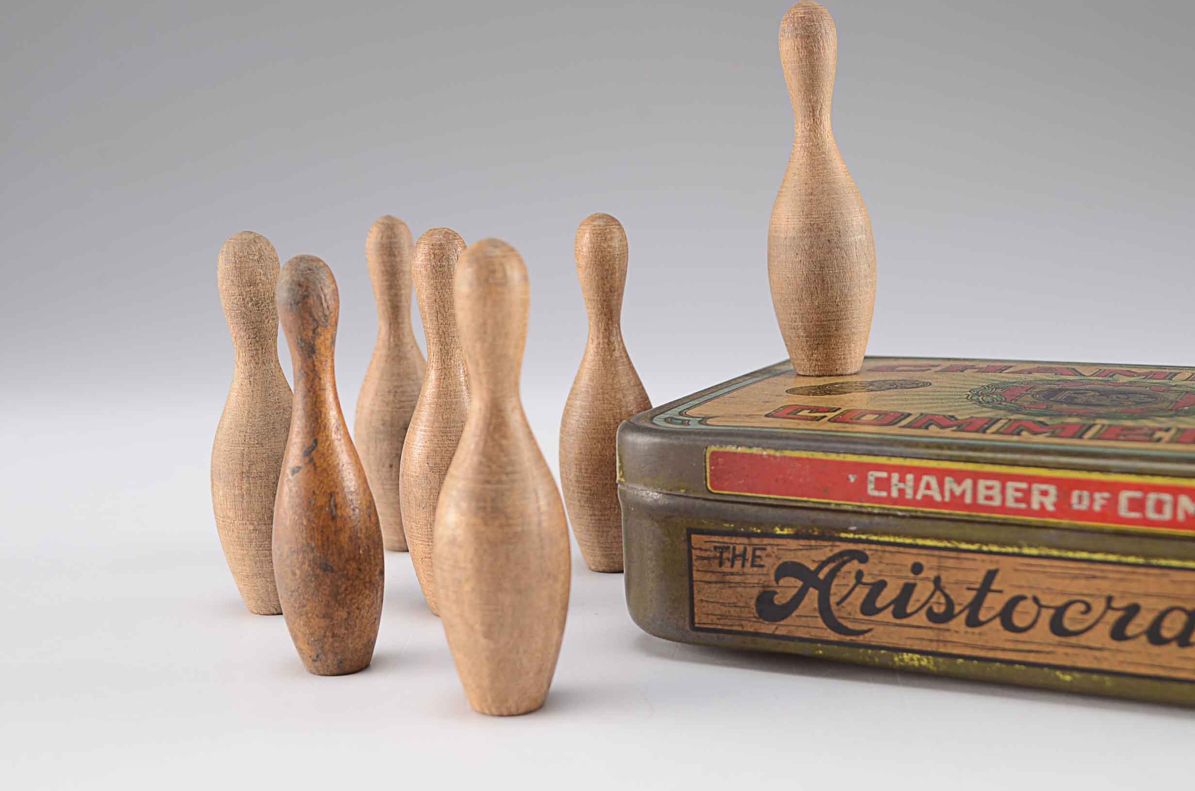 Small Vintage Wooden Bowling Pins in Tin