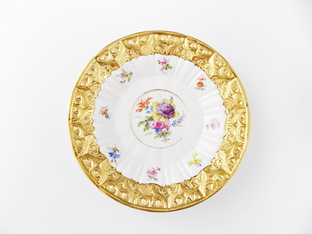 An Antique Meissen Tea Cup and Saucer in a Floral and Gold Pattern