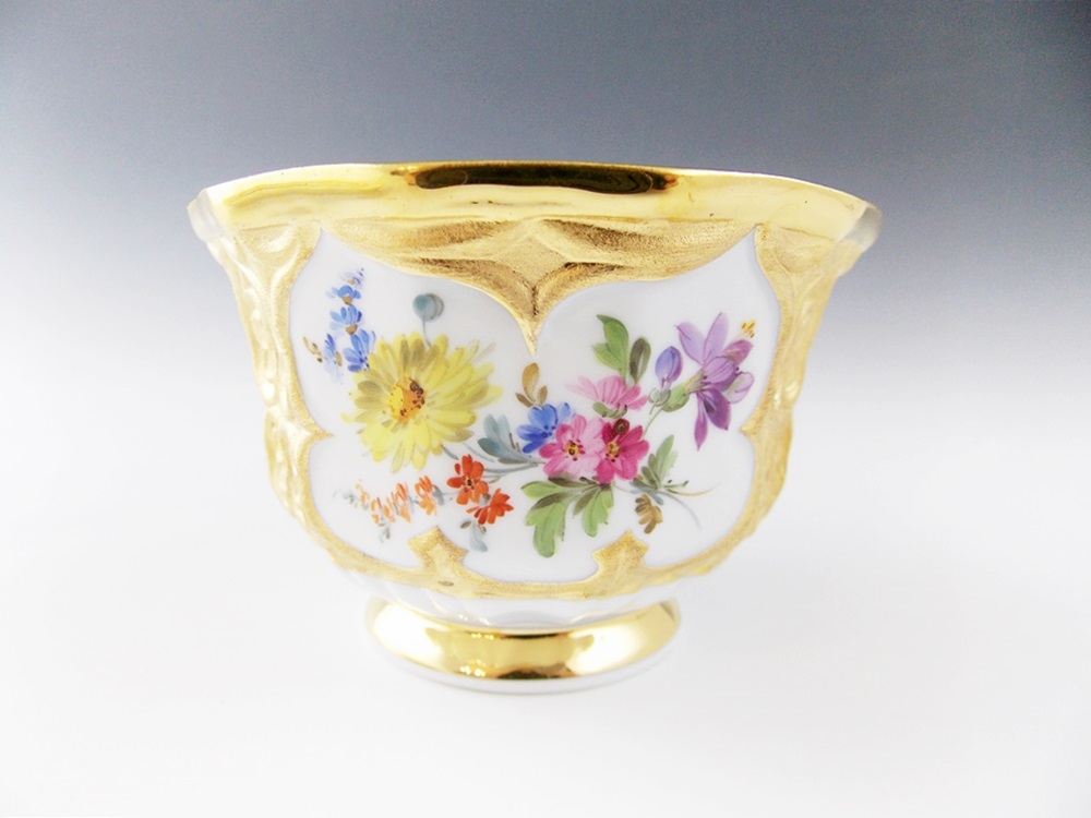 An Antique Meissen Tea Cup and Saucer in a Floral and Gold Pattern