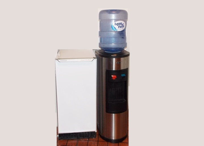An Oster Hot and Cold Water Dispenser and A Scotsman Automatic Ice Machine