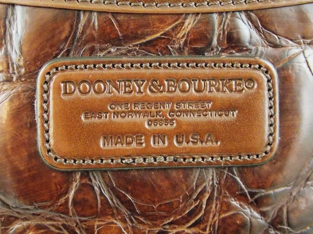 A Vintage Dooney & Bourke Crossover Style Bag in Brown Stamped Leather