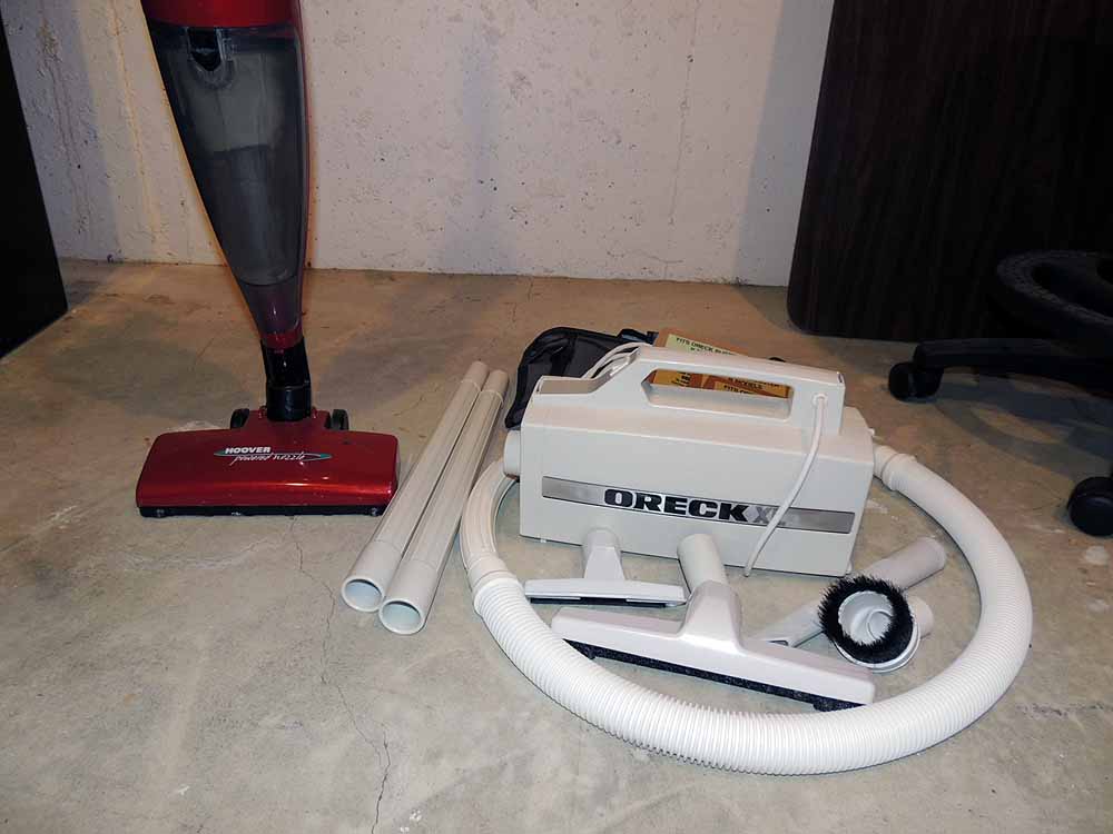 A Hoover "Flair" Bagless Stick Vacuum and OreckXL Portable Vacuum
