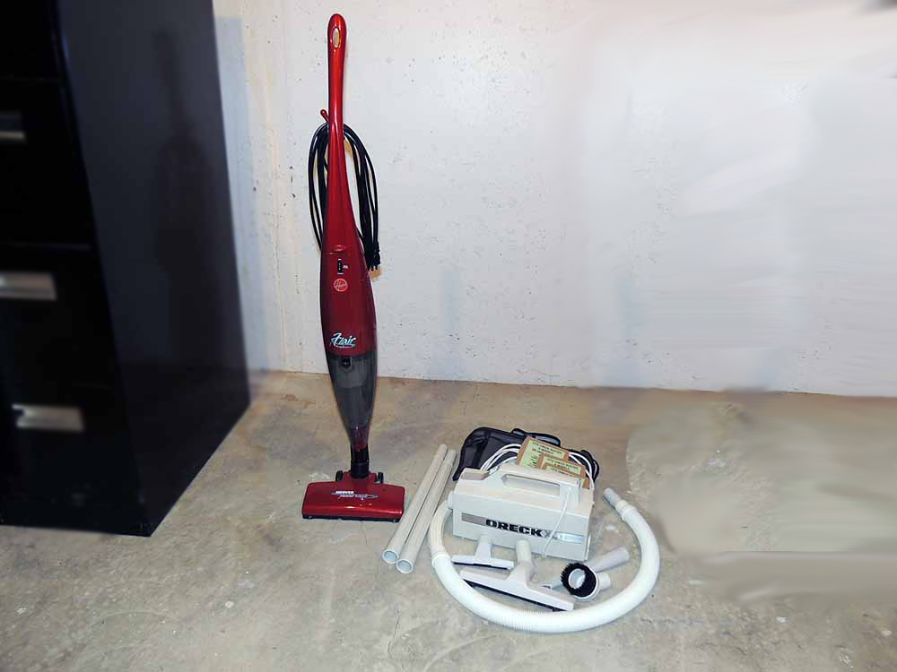 A Hoover "Flair" Bagless Stick Vacuum and OreckXL Portable Vacuum