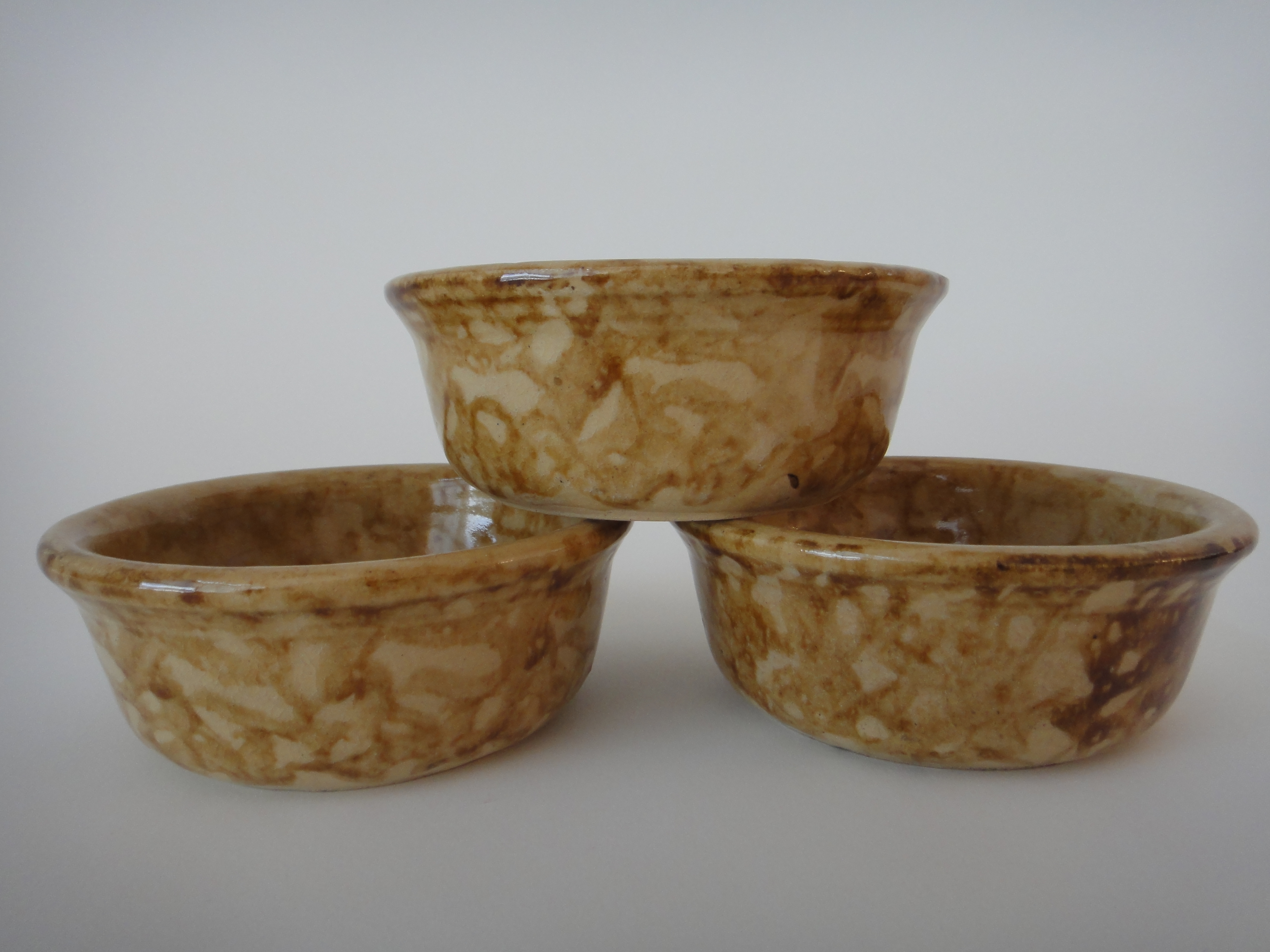 Three Yellow Ware Bowls