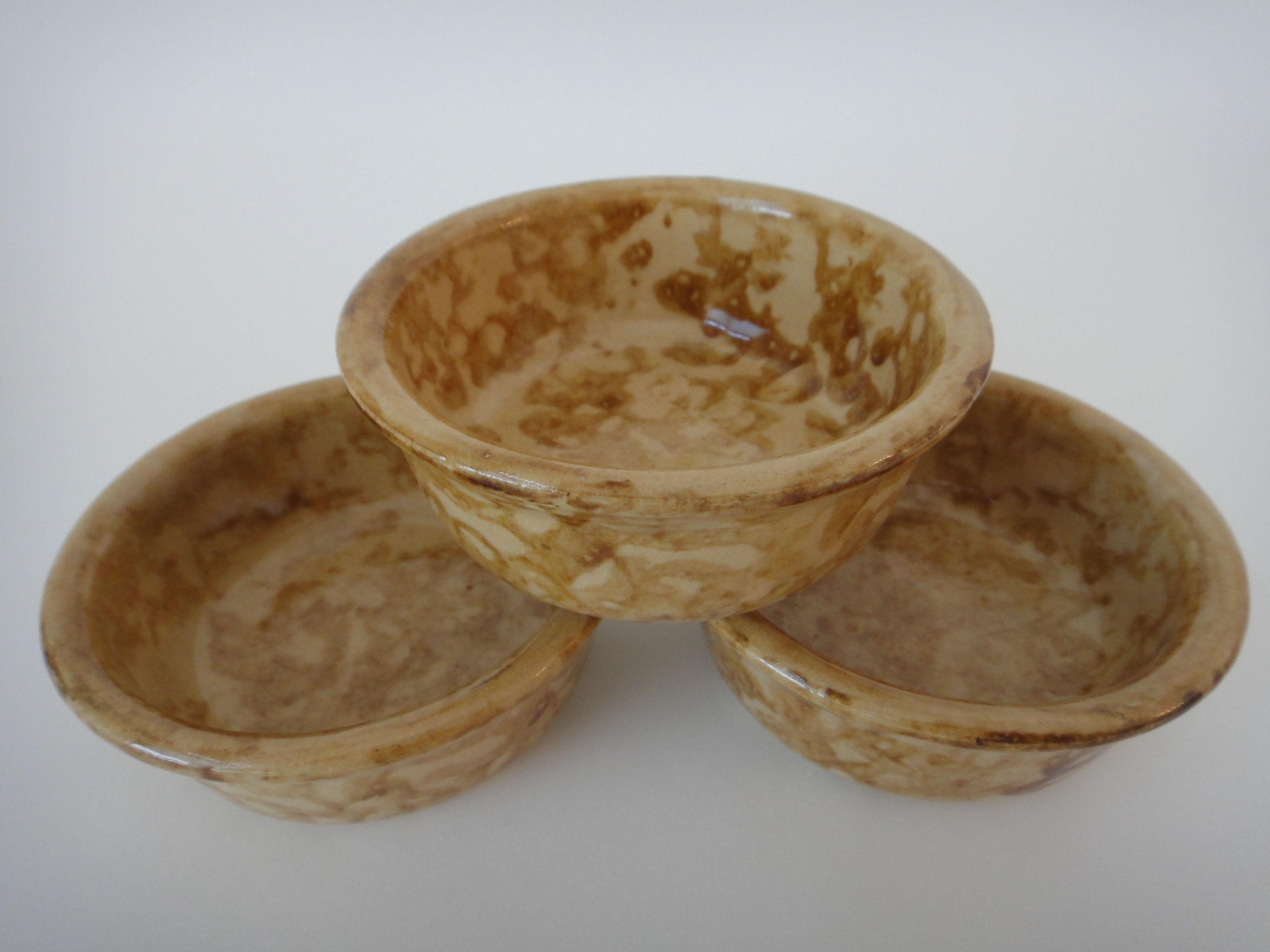 Three Yellow Ware Bowls