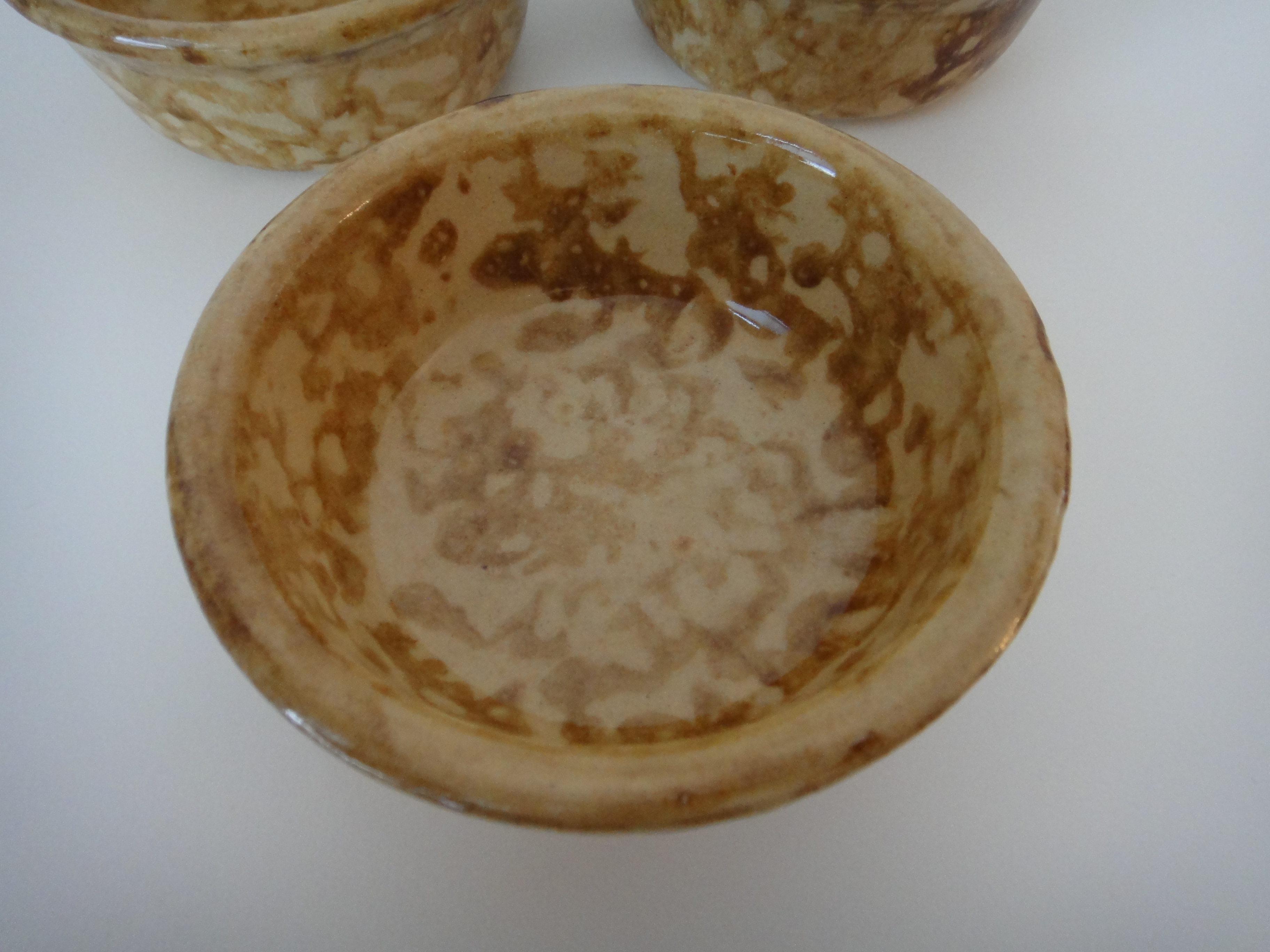 Three Yellow Ware Bowls