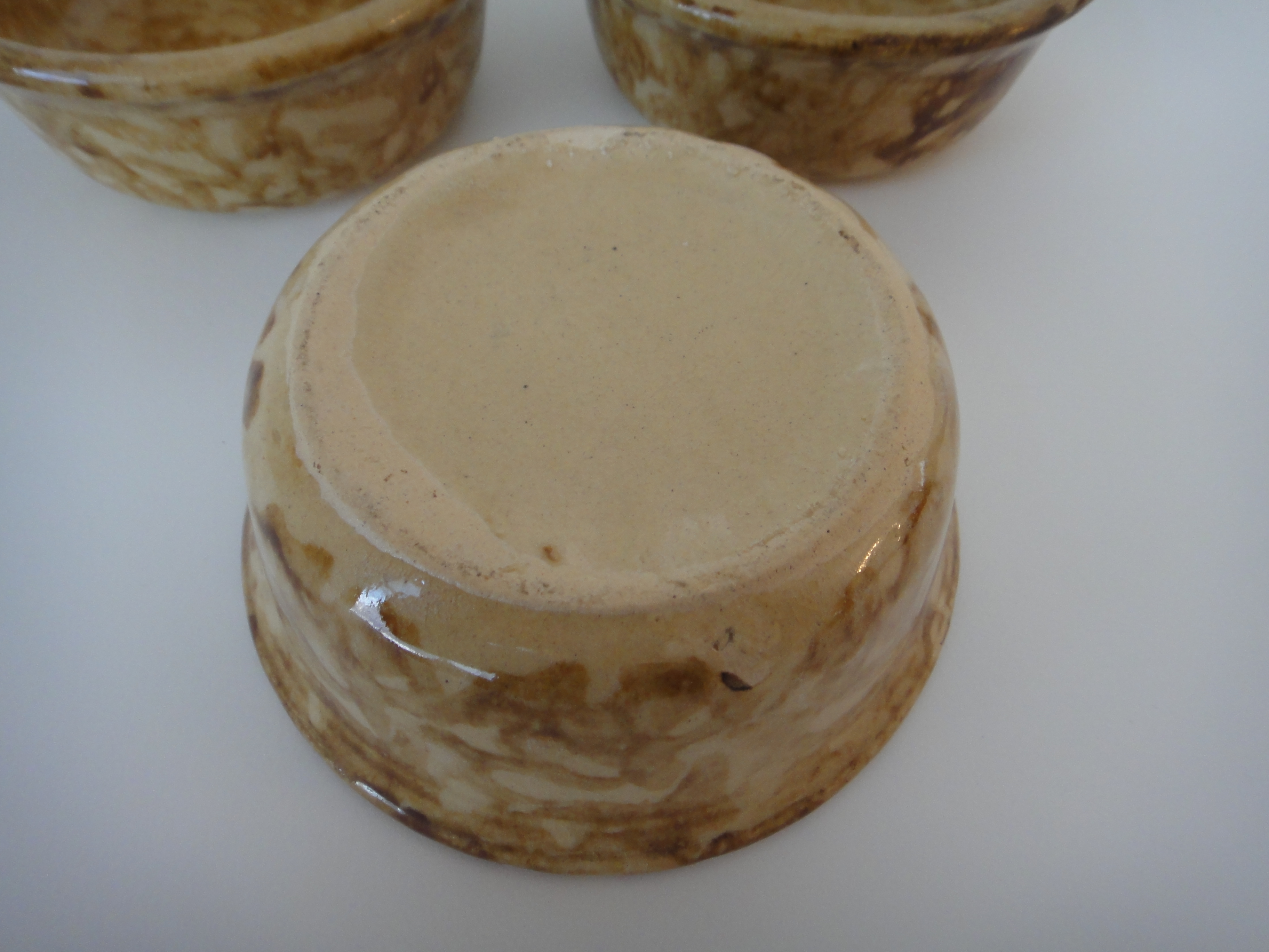 Three Yellow Ware Bowls