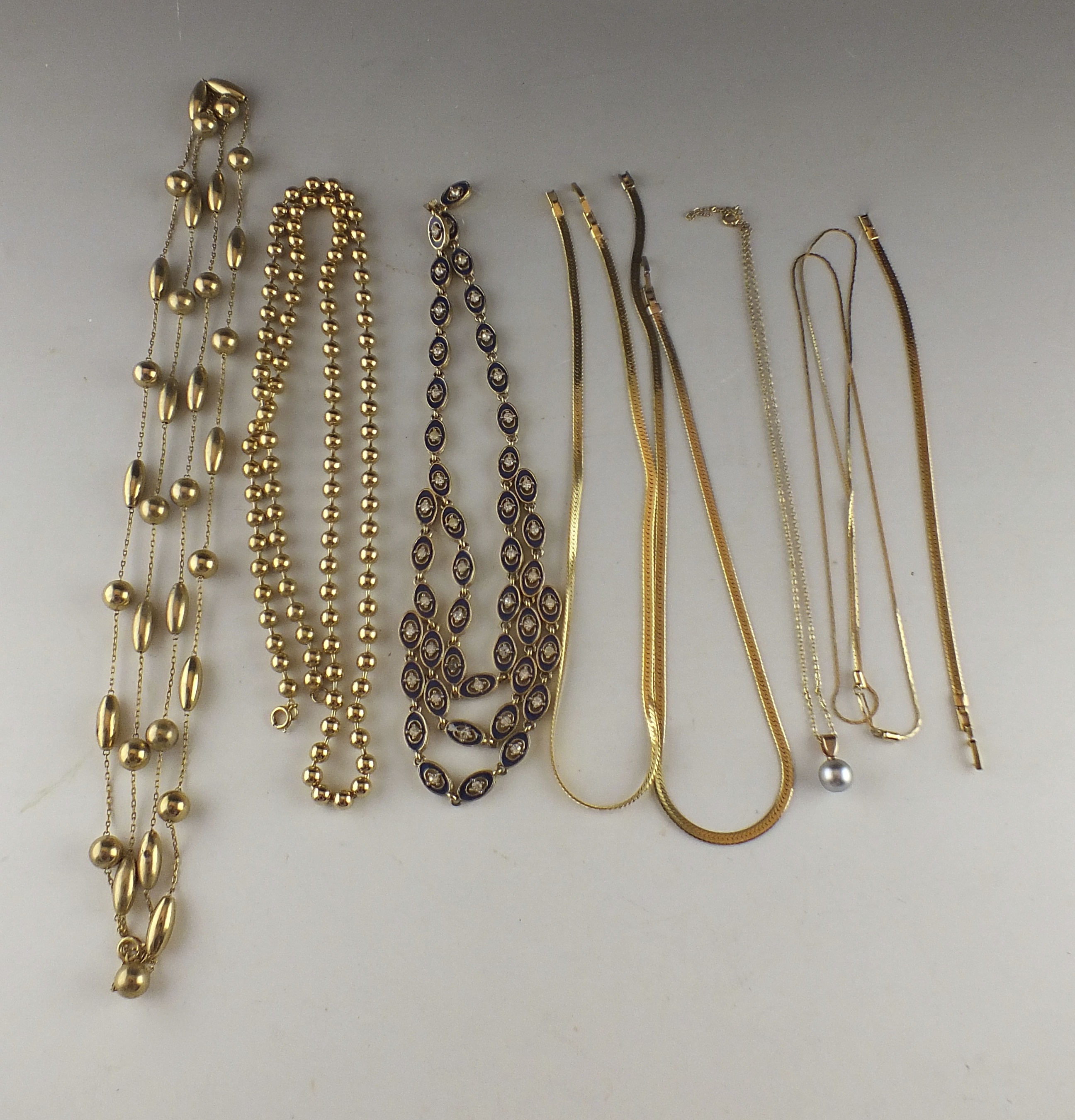 Eight Assorted  Gold Toned Necklaces 
