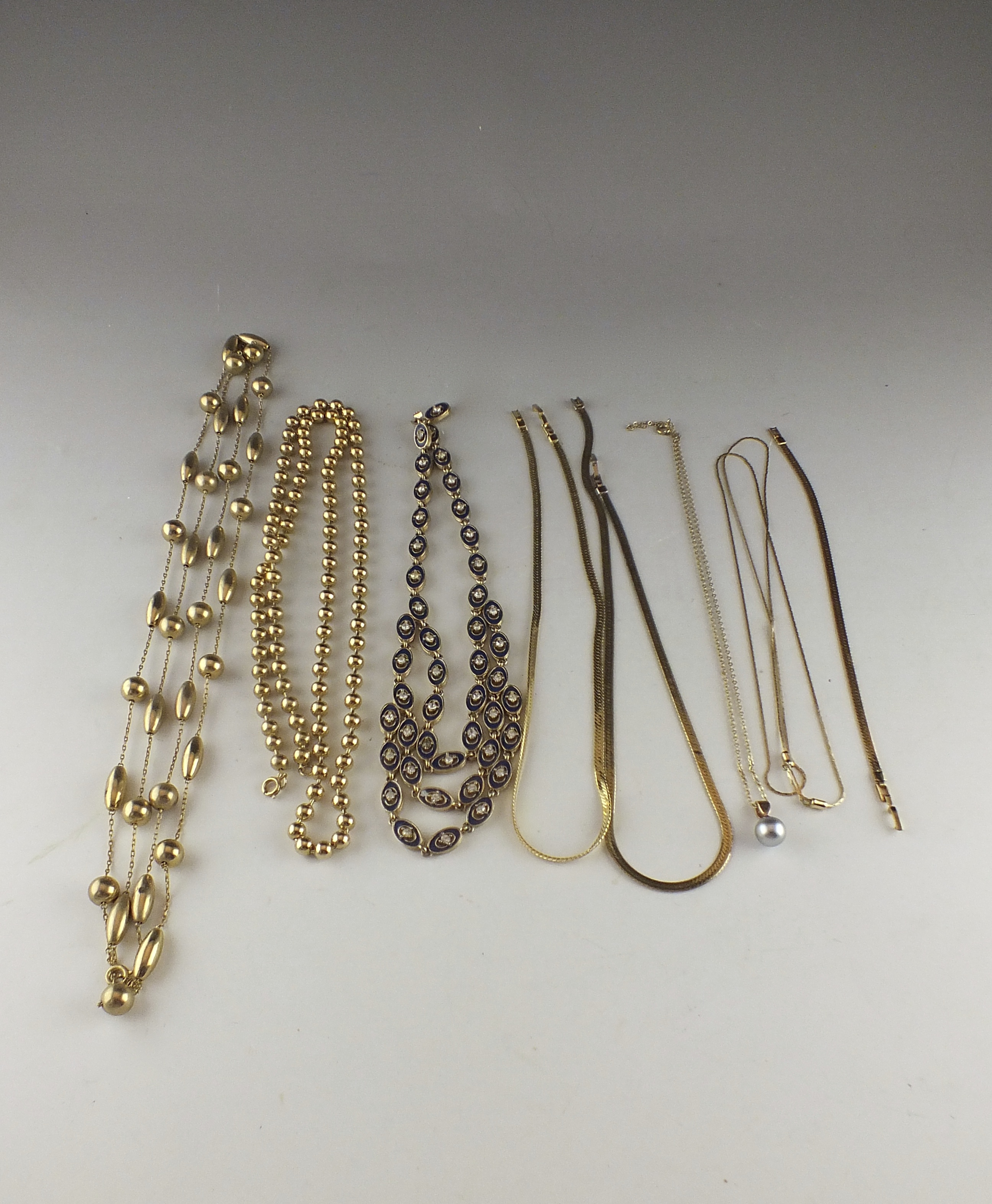 Eight Assorted  Gold Toned Necklaces 
