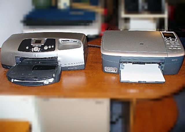 An HP Printer and an HP Photosmart 2575xi All-In-One Scanner Copier Printer