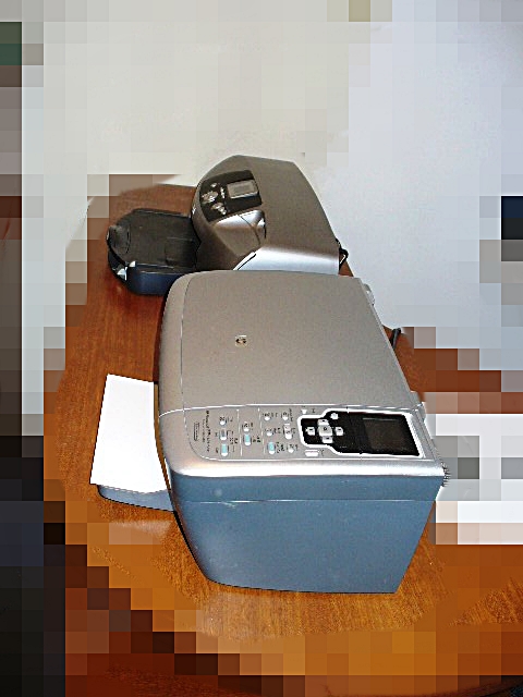 An HP Printer and an HP Photosmart 2575xi All-In-One Scanner Copier Printer