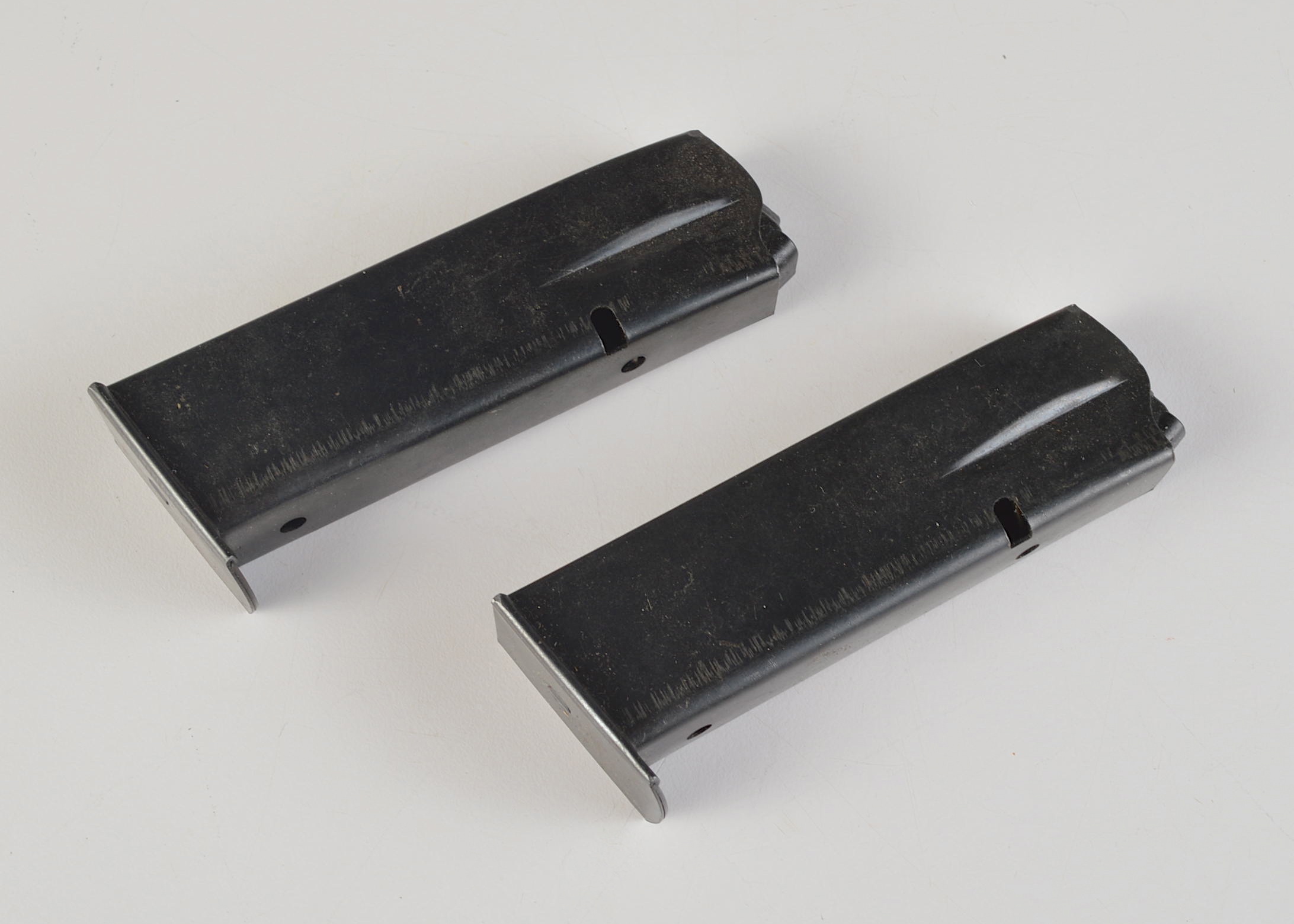 A Group of Two Magazine Clips for an Unknown Pistol