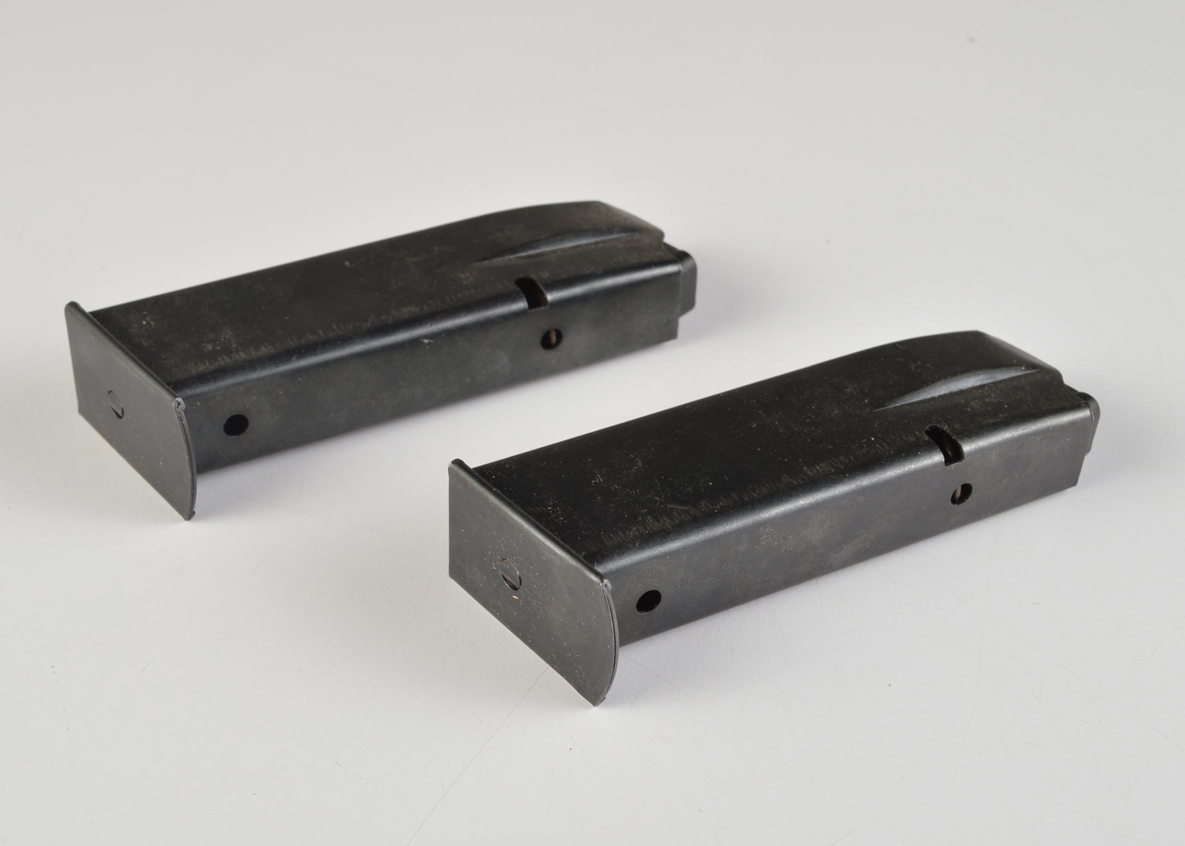 A Group of Two Magazine Clips for an Unknown Pistol
