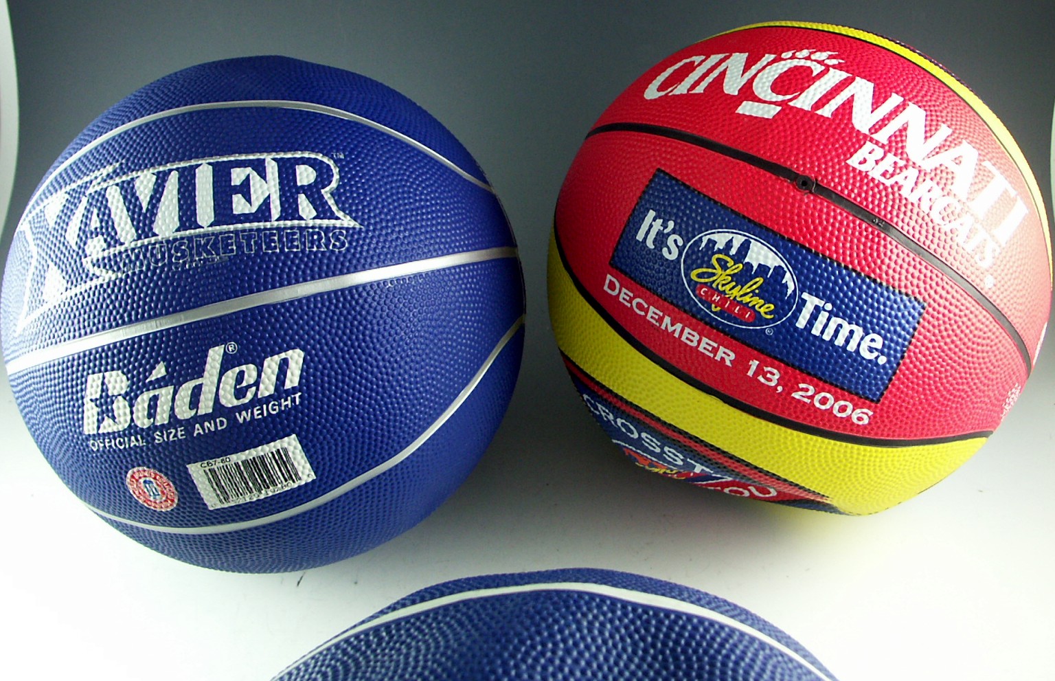 Four Collegiate Basketballs