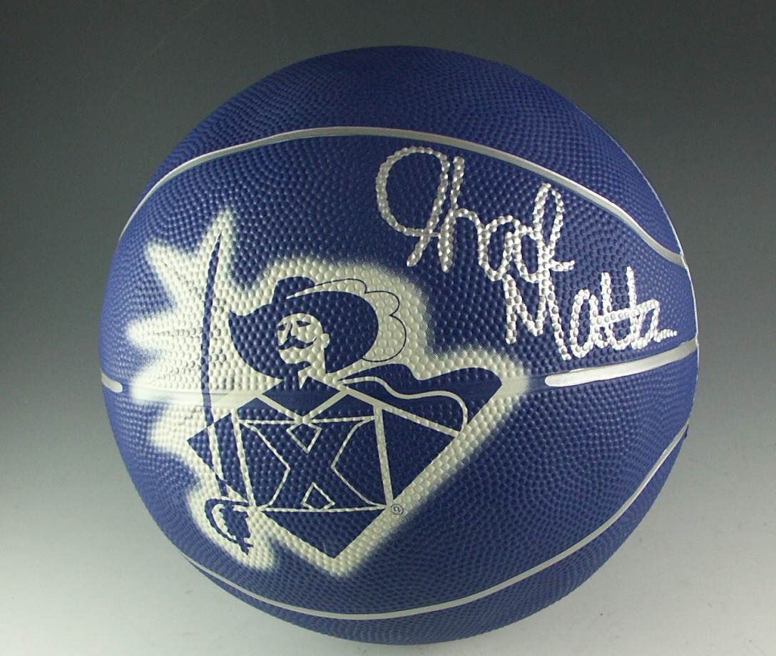 Four Collegiate Basketballs