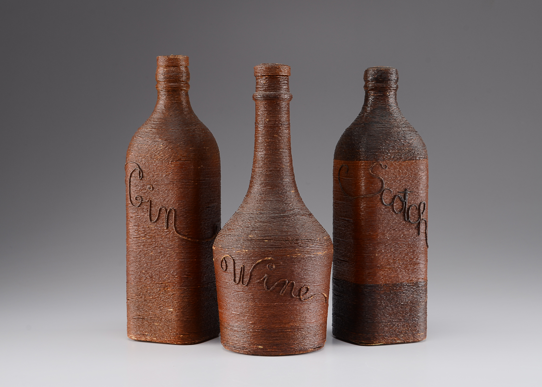 Trio of Vintage Wrapped Bottles 
