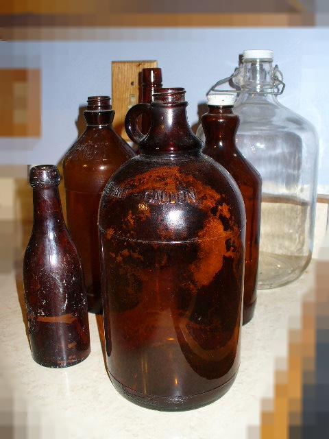 Collection of Vintage Brown Glass and Clear Glass Bottles