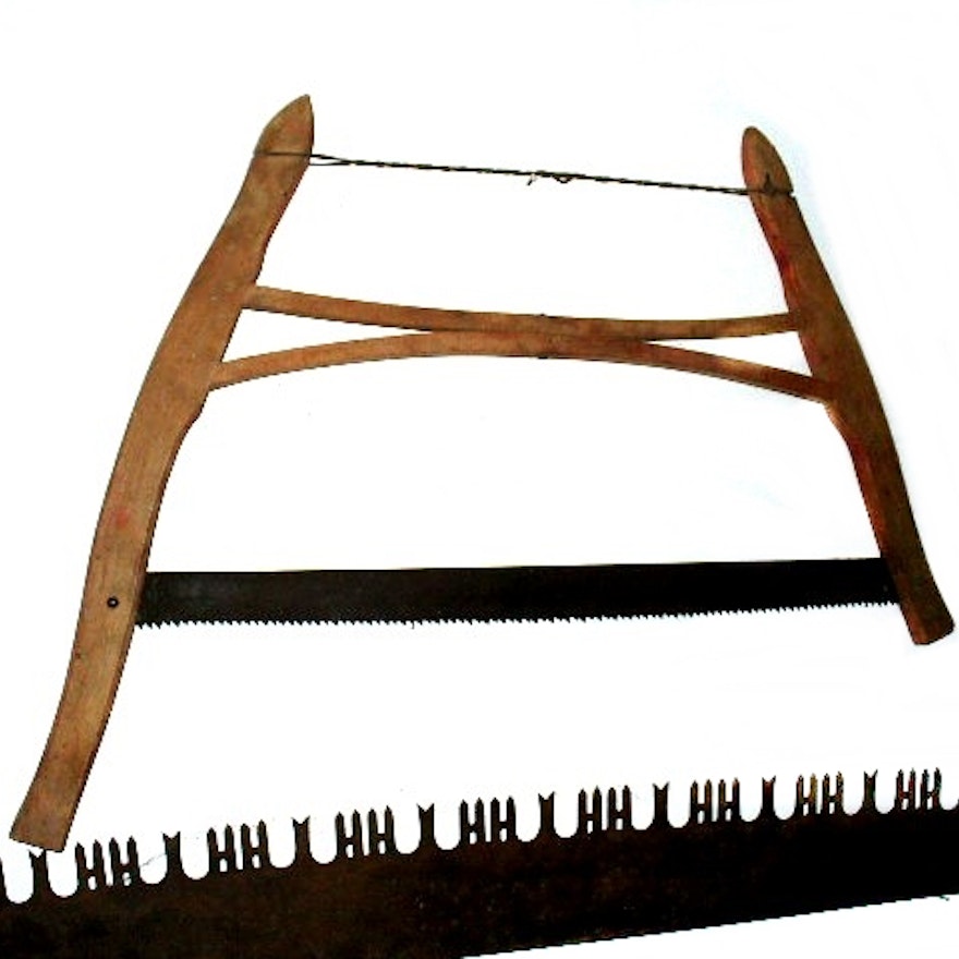 Four Vintage Two-Man and Single-Person Wooden Handled Saws