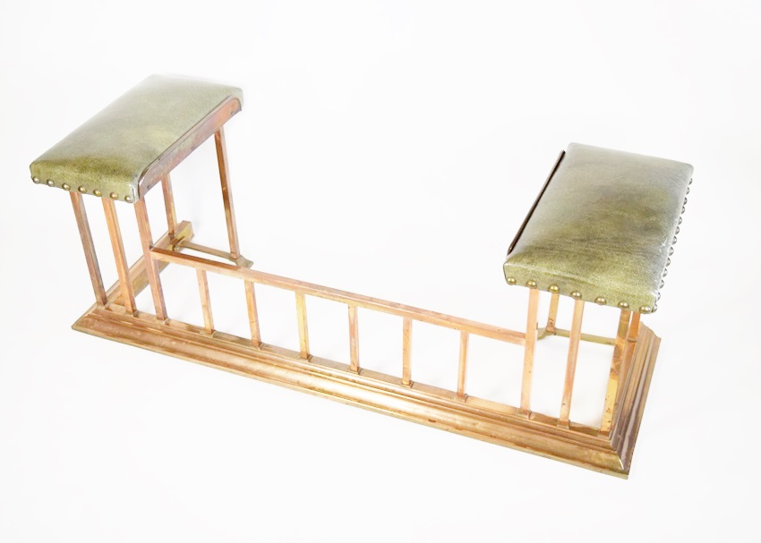 A Copper Fireplace Fender with Bench Seating at Each Side