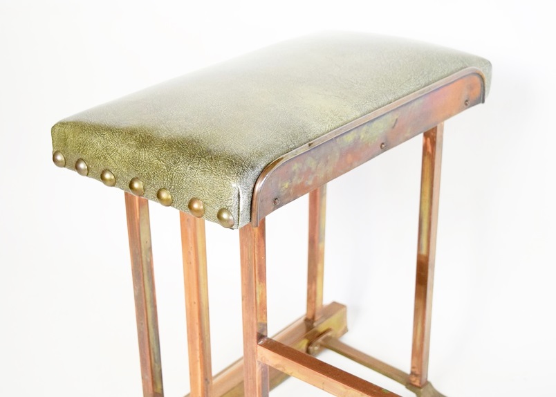 A Copper Fireplace Fender with Bench Seating at Each Side