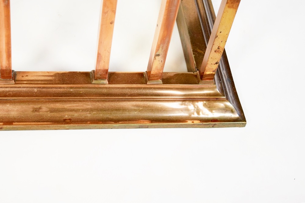 A Copper Fireplace Fender with Bench Seating at Each Side