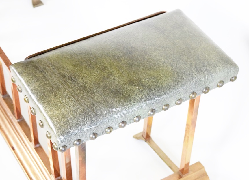 A Copper Fireplace Fender with Bench Seating at Each Side