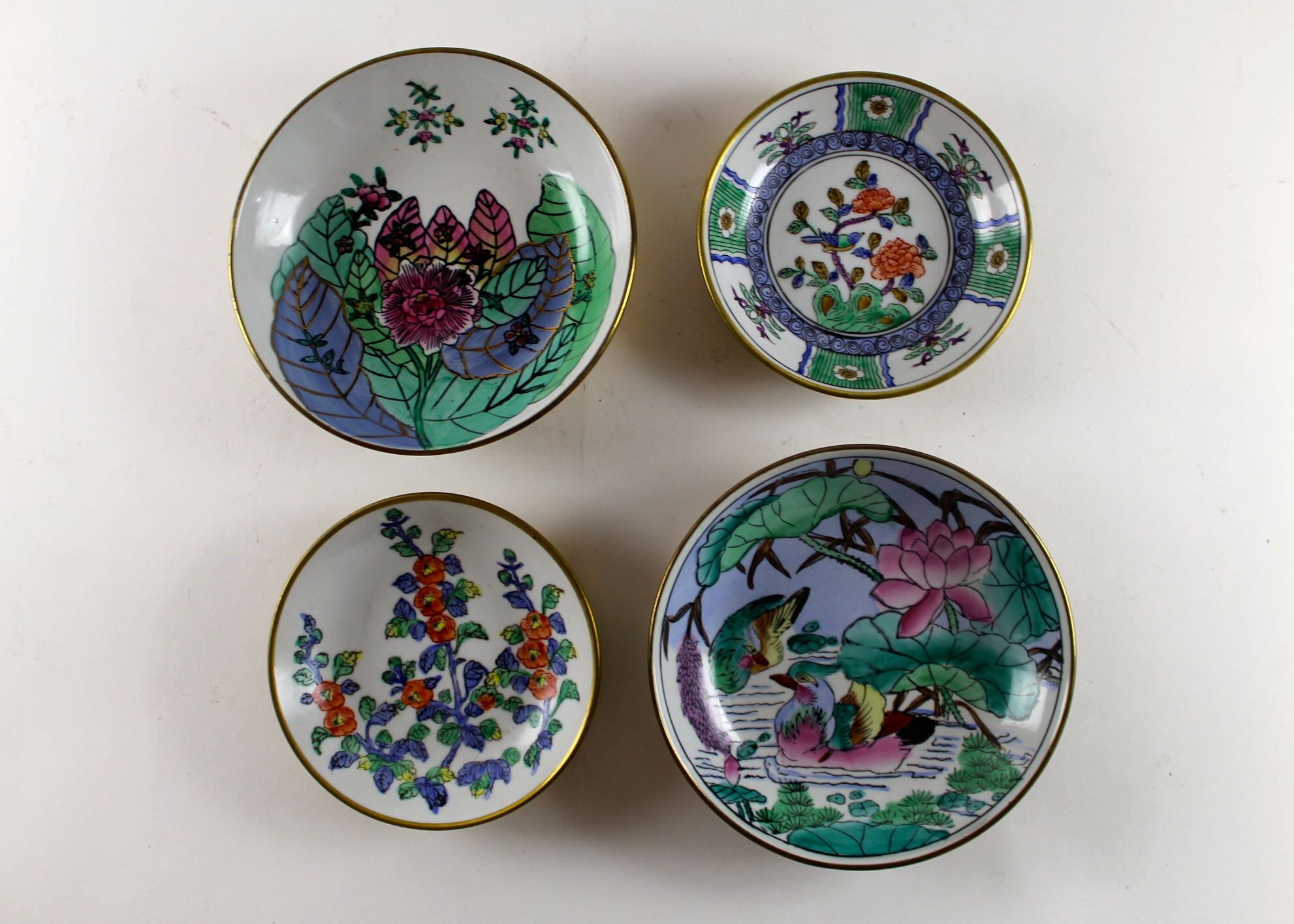 Four Hand-Painted Porcelain Plates