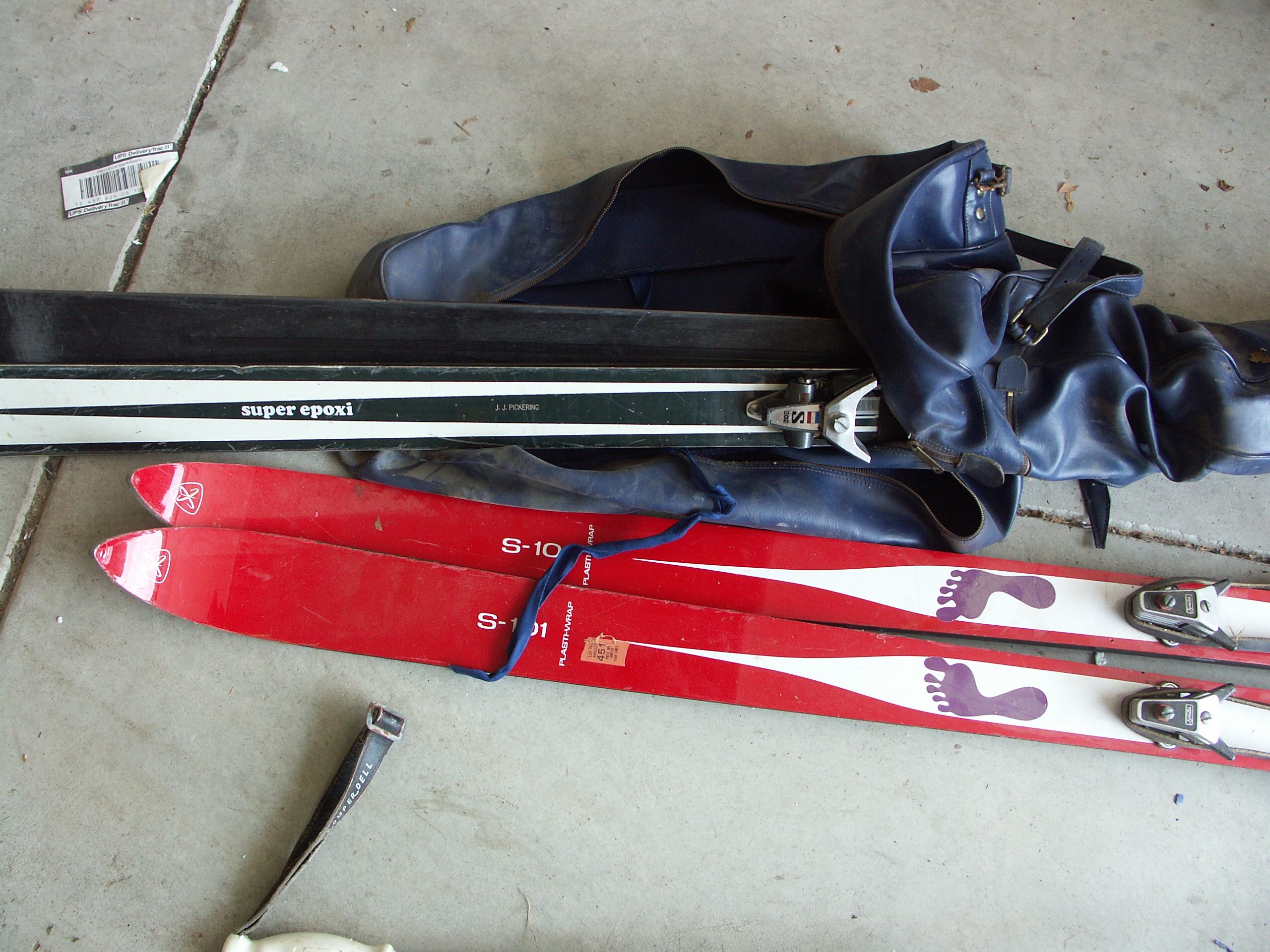 Lot of Vintage Skis and Pair of Ski Poles